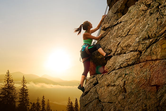Aries Personality Traits - Woman Rock Climbing