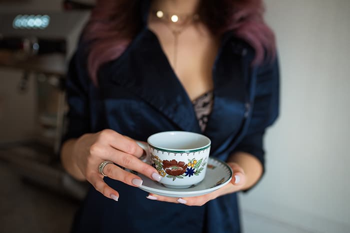 Signs You're Dating a Witch - woman holding teacup