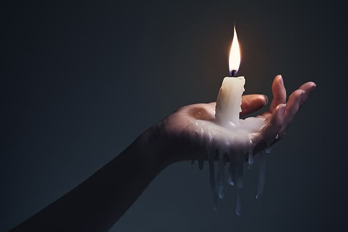 Candle Signs and Flame Meanings - Woman Holding Candle