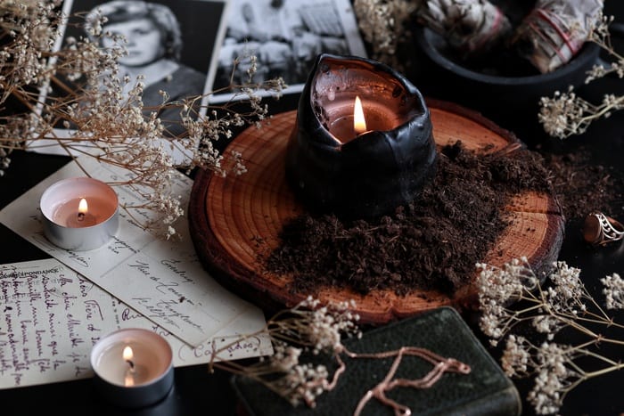 Samhain - Altar with photographs, pentacle, and black candle